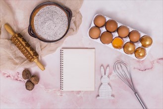 Gold easter eggs rack with notebook kitchen utensils rabbit