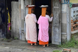 Buddhist nuns going begging