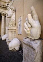 Colossal hand with index finger and head