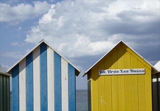 Colourful bathing houses on the beach at La Bree-les-Bains