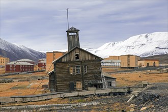 Derelict wooden building with tower at Pyramiden
