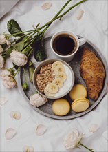 Flat lay breakfast bowl with cereal macarons