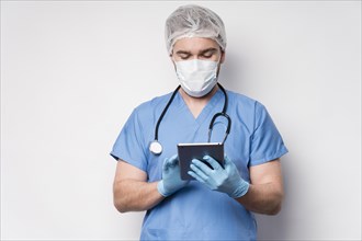 Portrait nurse browsing tablet