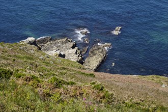 Cliff with rocks in the Atlantic Ocean near Cap Frehel in Plevenon