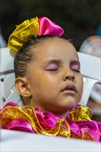 Little girl in folklore dress sleeping