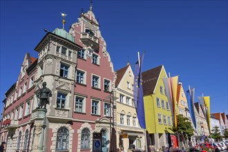 Town hall with statue of Georg von Frundsberg and flags m Marienplatz