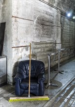Leather armchairs and bistro tables inside a bunker