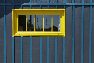Yellow window frames on an art glasshouse in Le Chateau-d'Oleron