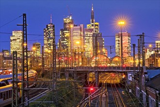 Elevated city view in the evening with railway tracks