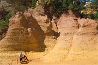 Tourists visiting the old ochre quarry at Roussillon