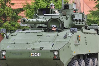 Driver and commander in turret of MOWAG Piranha IIIC armoured fighting vehicle of the Belgian army