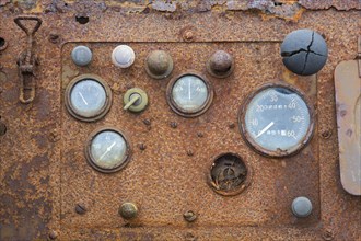 Old dashboard of rusty amphibian vehicle at deserted Kinnvika Arctic research station