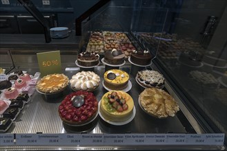 Various fruit cakes in a display in a confectionery