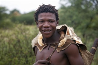 Bushman dressed in animal skin in the Kalahari desert near Ghanzi