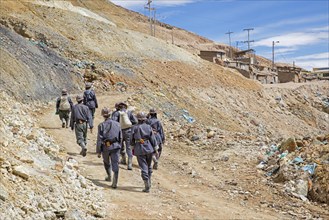 Tourists with guide visiting silver mine on the Cerro Rico de Potosi