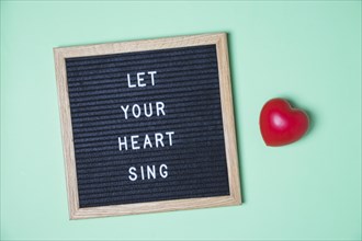 Message board red heart turquoise background