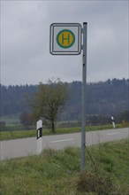 Bus stop sign at the roadside