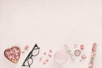 Rose petals with glasses candle table