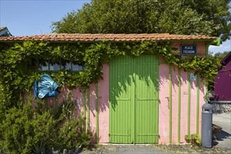 Green gate at an art gallery in Le Chateau-d'Oleron