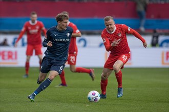 Patrick OSTERHAGE VFL Bochum in a duel with Lennard MALONEY 1. FC Heidenheim re