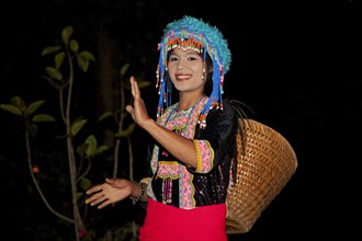 Portrait of traditional tribal dancer wearing headdress with colourful beads