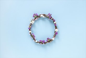Elevated view wreath made up flowers blue backdrop
