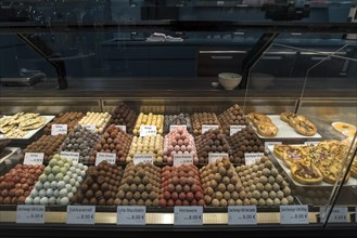 Various chocolates in a display in a confectionery