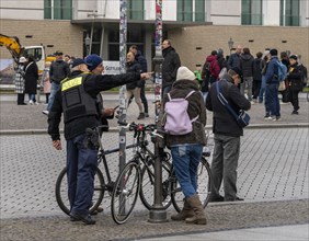 Police officer talking to cyclists