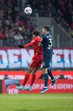 Christian E. GAMBOA LUNA VFL Bochum in aerial battle with Adrian BECK 1. FC Heidenheim re