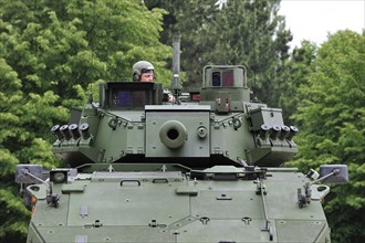 Commander in turret of MOWAG Piranha IIIC armoured fighting vehicle of the Belgian army