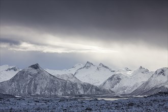 Lake and snow covered mountains in winter