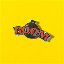Boom comic text speech bubble with bomb yellow background
