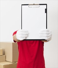 Delivery man showing clipboard