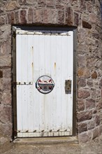 Door to the historic lighthouse Phare du Cap Frehel near Plevenon