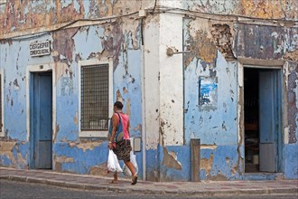 Paint flaking off house fronts of old colonial buildings in the historic center of the city Mindelo on the island Sao Vicente