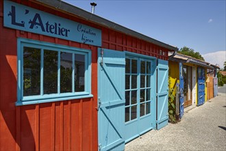 Studios in colourful former fishermen's huts in Le Chateau-d'Oleron