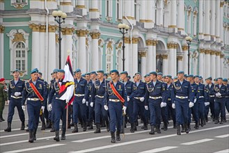 Military parade of Russian Airborne cadets wearing telnyashkas and blue berets marching in front of the Hermitage in Saint Petersburg