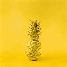 Juicy pineapple yellow background