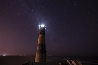 Pelican Point lighthouse with starry sky