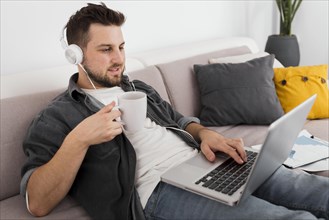 Portrait casual male enjoying work from home