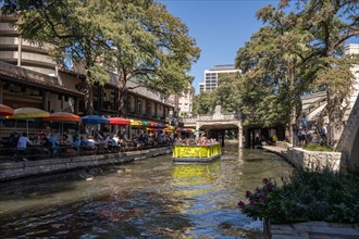 Tourists and boat at the Riverwalk