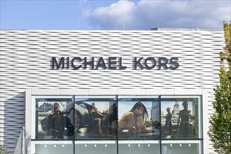 Logo of the bag company Michael Kors