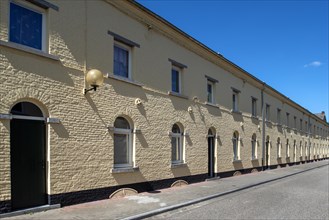 Yellow workers' townhouses