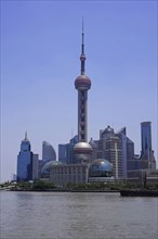 View from The Bund across the Huangpu River to the skyline of the Pudong Special Economic Zone with Oriental Pearl Tower