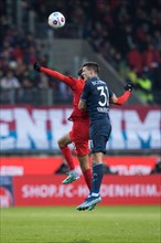 Keven SCHLOTTERBECK VFL Bochum in aerial battle with Eren DINKCI 1. FC Heidenheim li