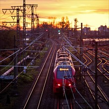 Elevated view of a local train at sunset