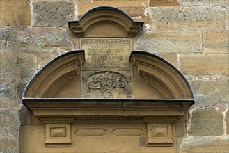 Former children's tomb with a poem above the side entrance of St Luke's Church
