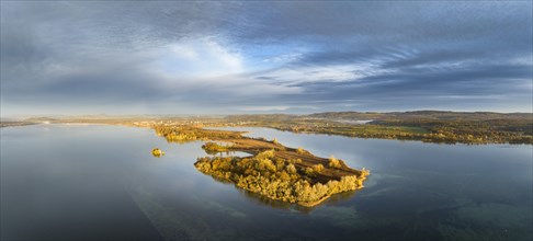 Aerial panorama of the Mettnau peninsula in western Lake Constance illuminated by the morning sun