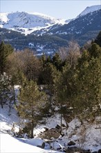 Winter landscape with snow in the snowy mountains of the Pyrenees of Andorra