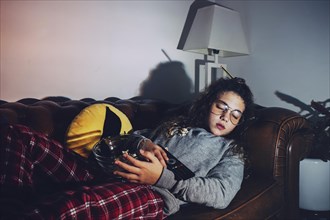 Girl sleeping with tv turned